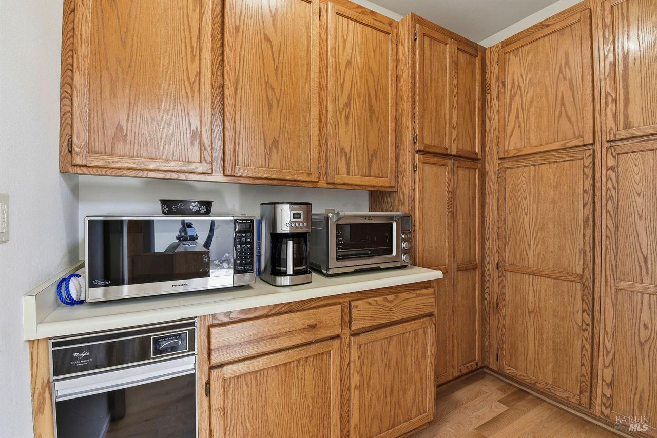 140 Massimo Circle Santa Rosa, CA 95404 - Photo 16 of 41 a kitchen with appliances a microwave and cabinets