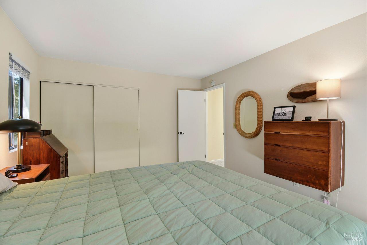 140 Massimo Circle Santa Rosa, CA 95404 - Photo 24 of 41 a bedroom with a bed and a lamp on dresser