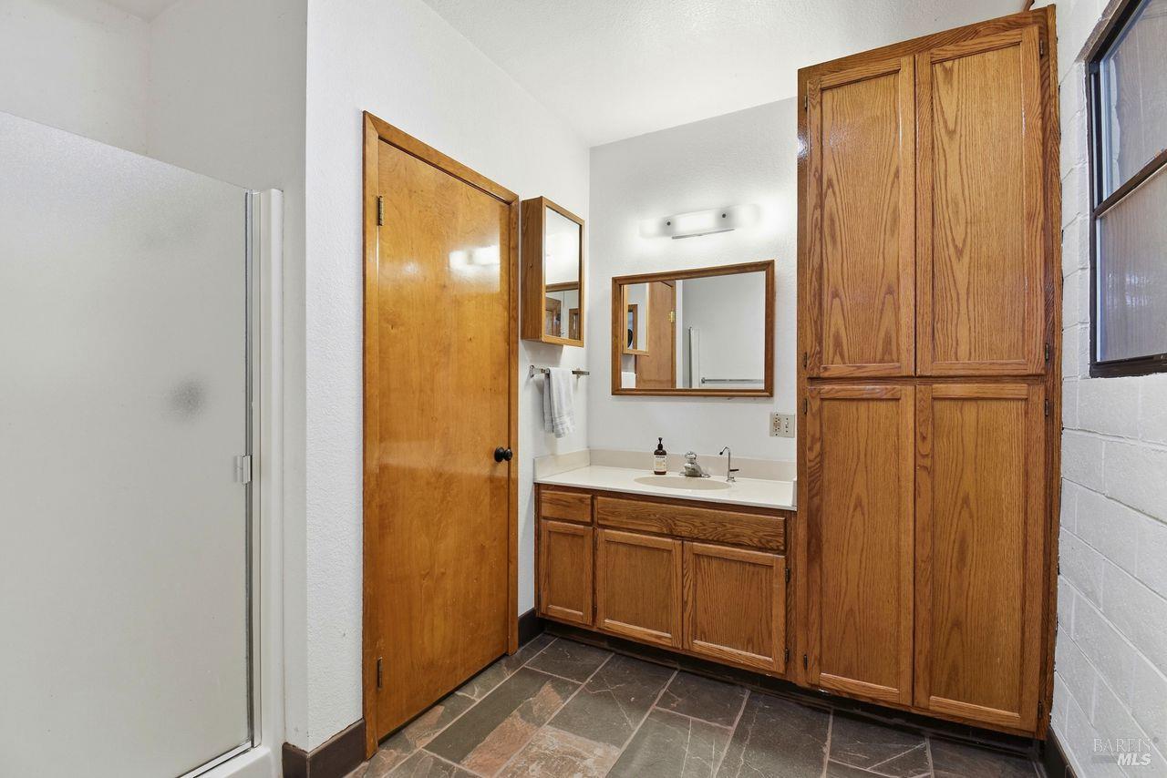 140 Massimo Circle Santa Rosa, CA 95404 - Photo 34 of 41 a bathroom with a double vanity sink and mirror