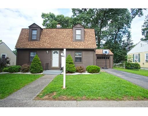 74 Oregon Street Springfield, MA 01118 - Photo 1 of 21 a front view of a house with garden and trees