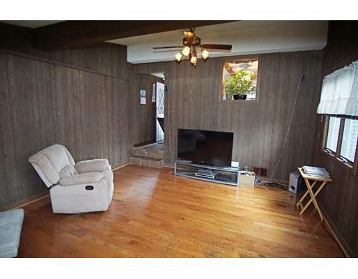 74 Oregon Street Springfield, MA 01118 - Photo 16 of 21 a living room with furniture and a flat screen tv