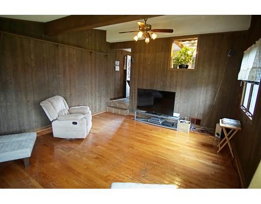 74 Oregon Street Springfield, MA 01118 - Photo 17 of 21 a living room with furniture and a fireplace