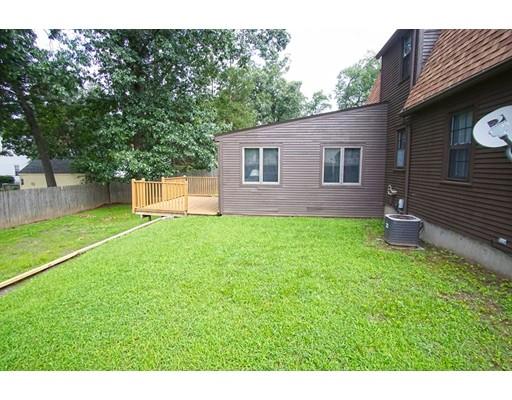 74 Oregon Street Springfield, MA 01118 - Photo 20 of 21 a backyard of a house with table and chairs