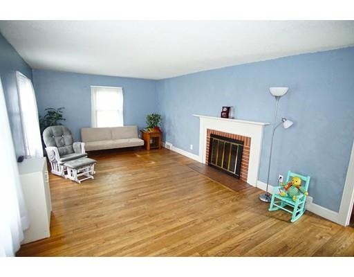 74 Oregon Street Springfield, MA 01118 - Photo 3 of 21 a living room with furniture and a fireplace