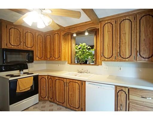 74 Oregon Street Springfield, MA 01118 - Photo 5 of 21 a kitchen with stainless steel appliances granite countertop a stove a sink and a microwave