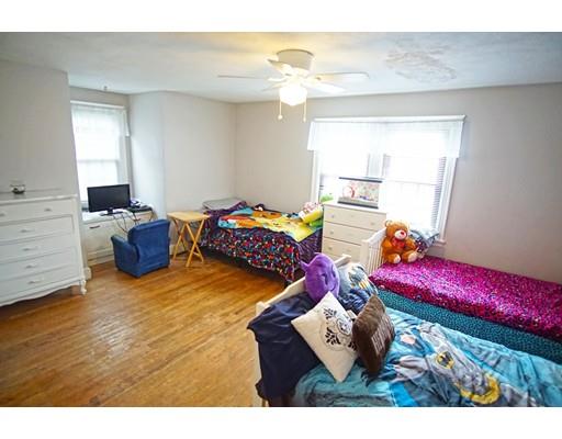 74 Oregon Street Springfield, MA 01118 - Photo 10 of 21 a bedroom with a bed and window