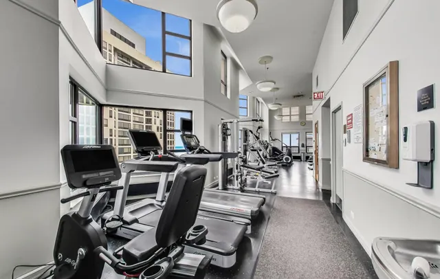 a view of a workspace with furniture and a kitchen