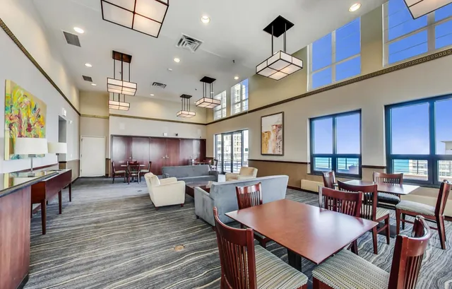 a large kitchen with a table and chairs