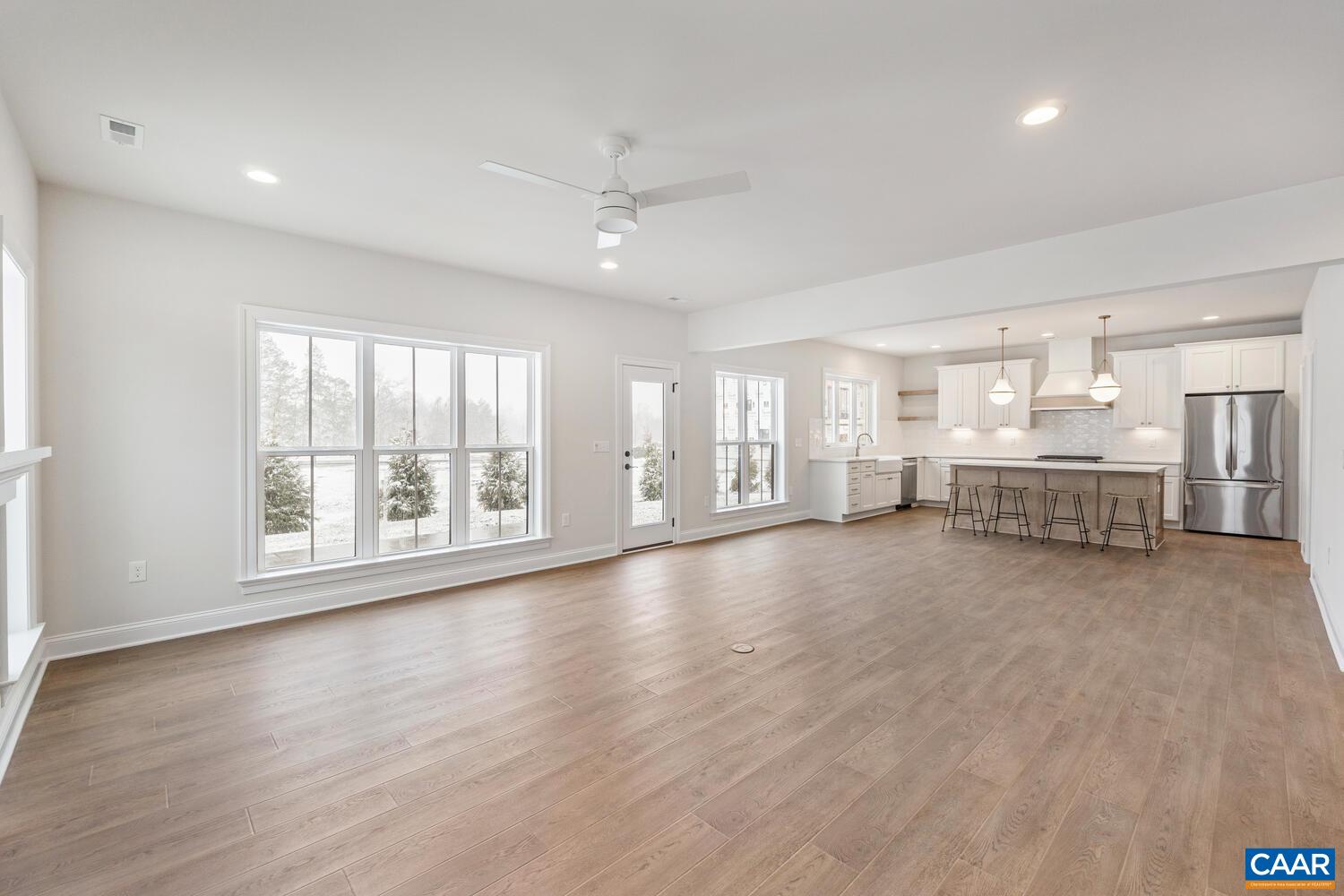 1731 Fowler Street Charlottesville, VA 22901 - Photo 12 of 54 a view of an empty room with a window and wooden floor