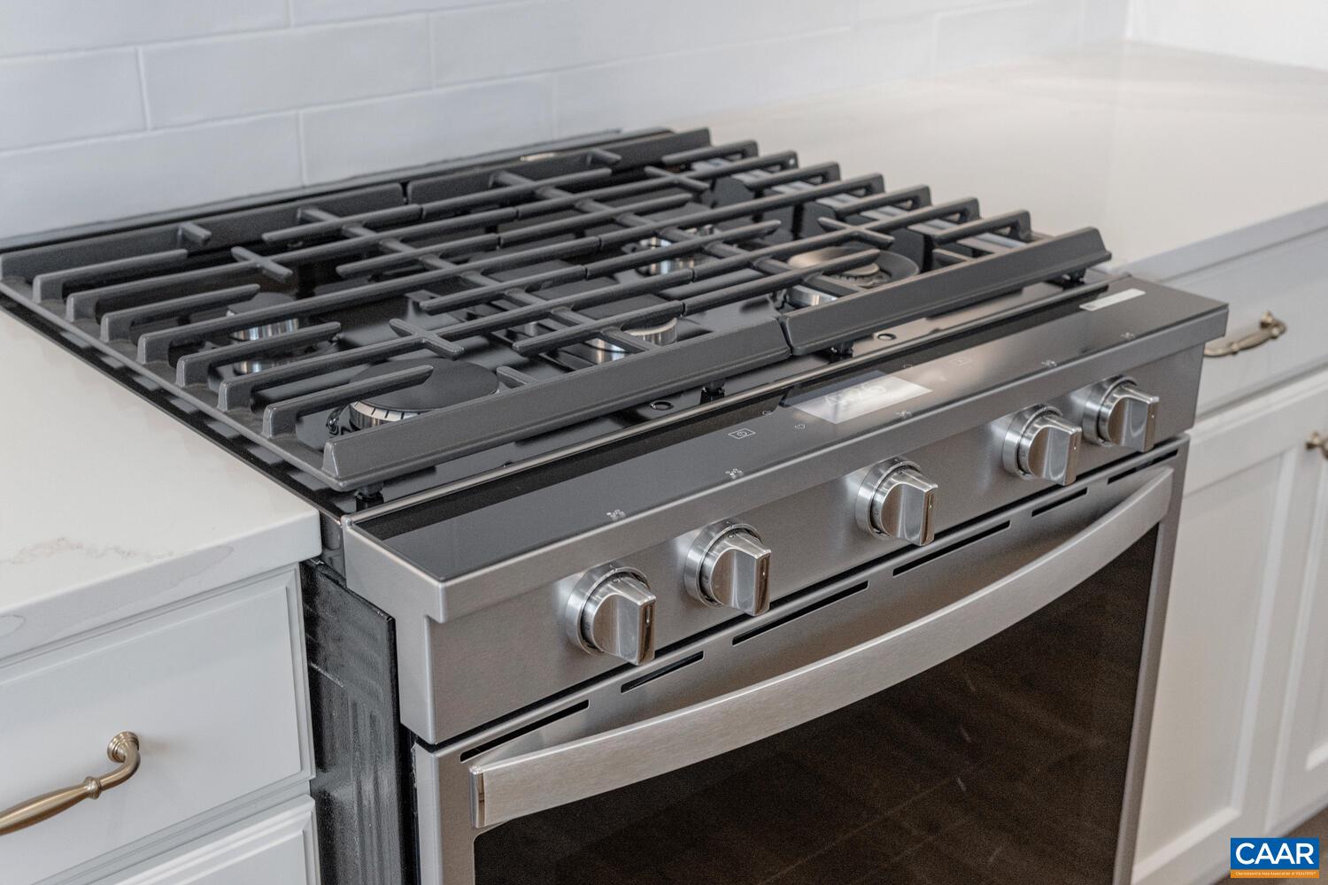 1731 Fowler Street Charlottesville, VA 22901 - Photo 16 of 54 a close up of a stove sitting inside of a kitchen