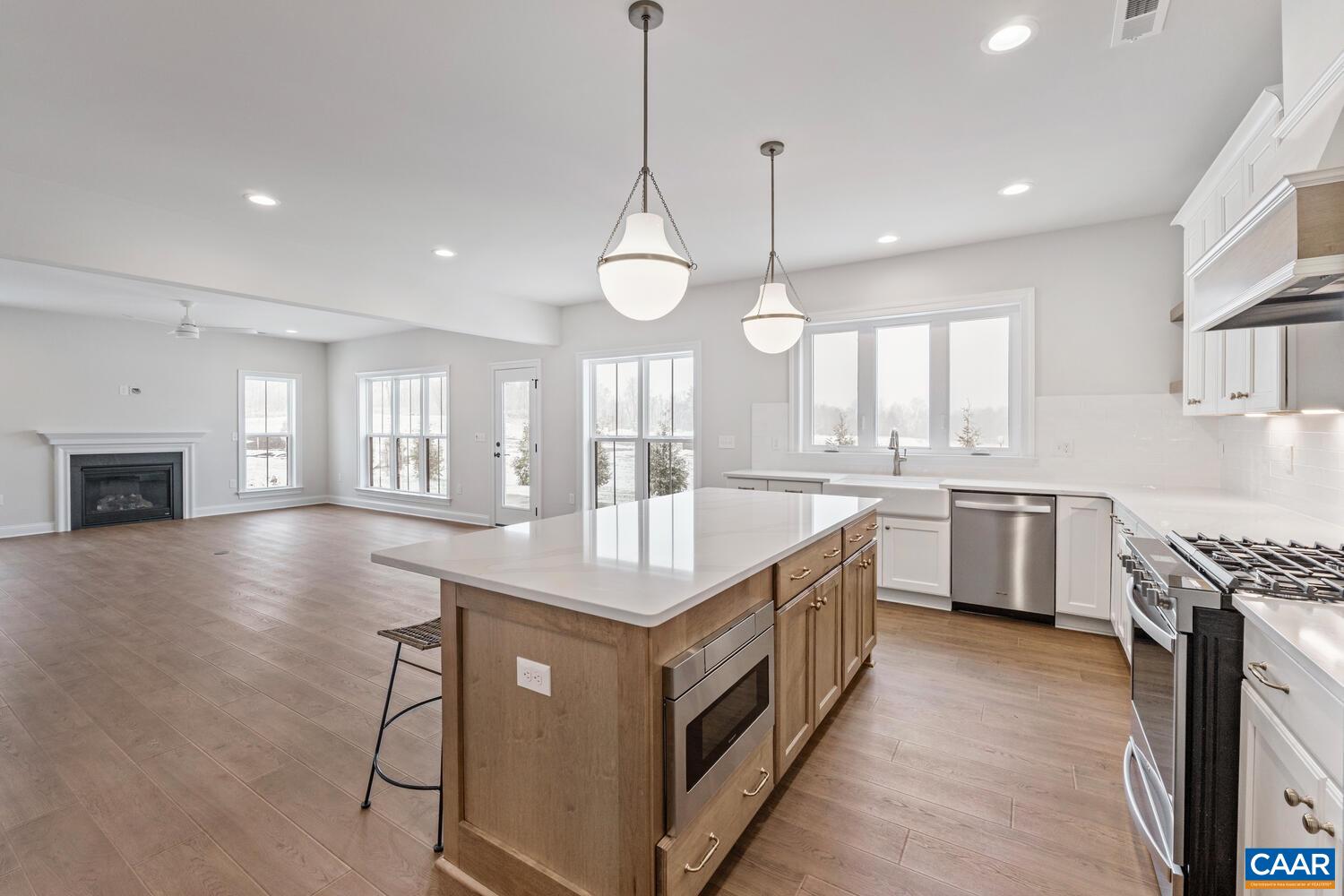 1731 Fowler Street Charlottesville, VA 22901 - Photo 20 of 54 a kitchen with stainless steel appliances granite countertop a stove and a sink