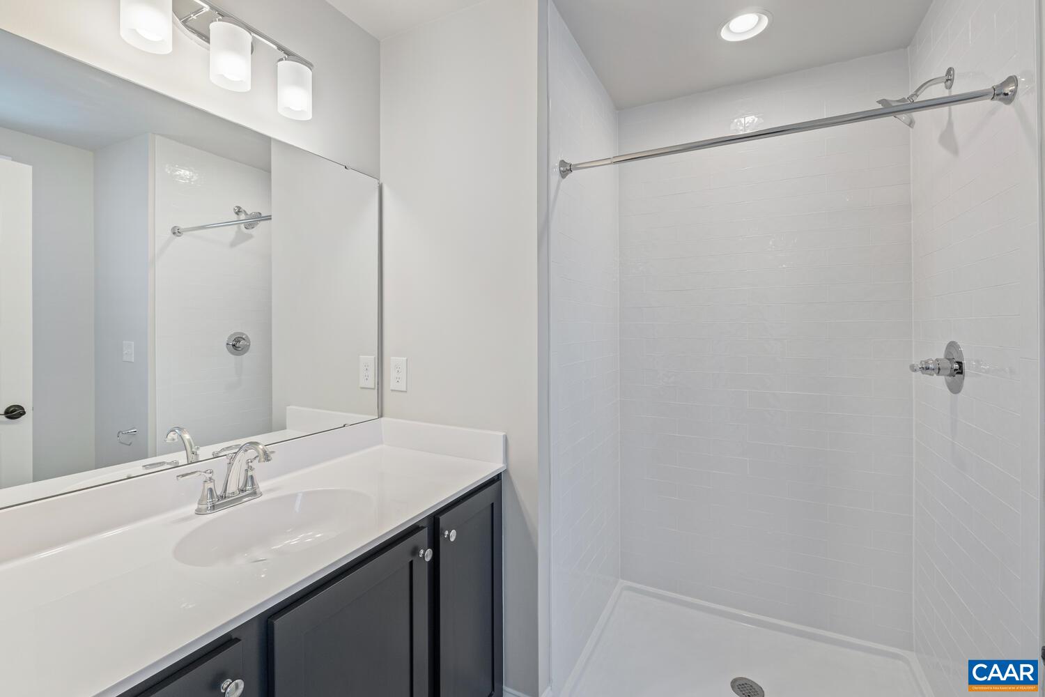 1731 Fowler Street Charlottesville, VA 22901 - Photo 33 of 54 a bathroom with a double vanity sink and mirror