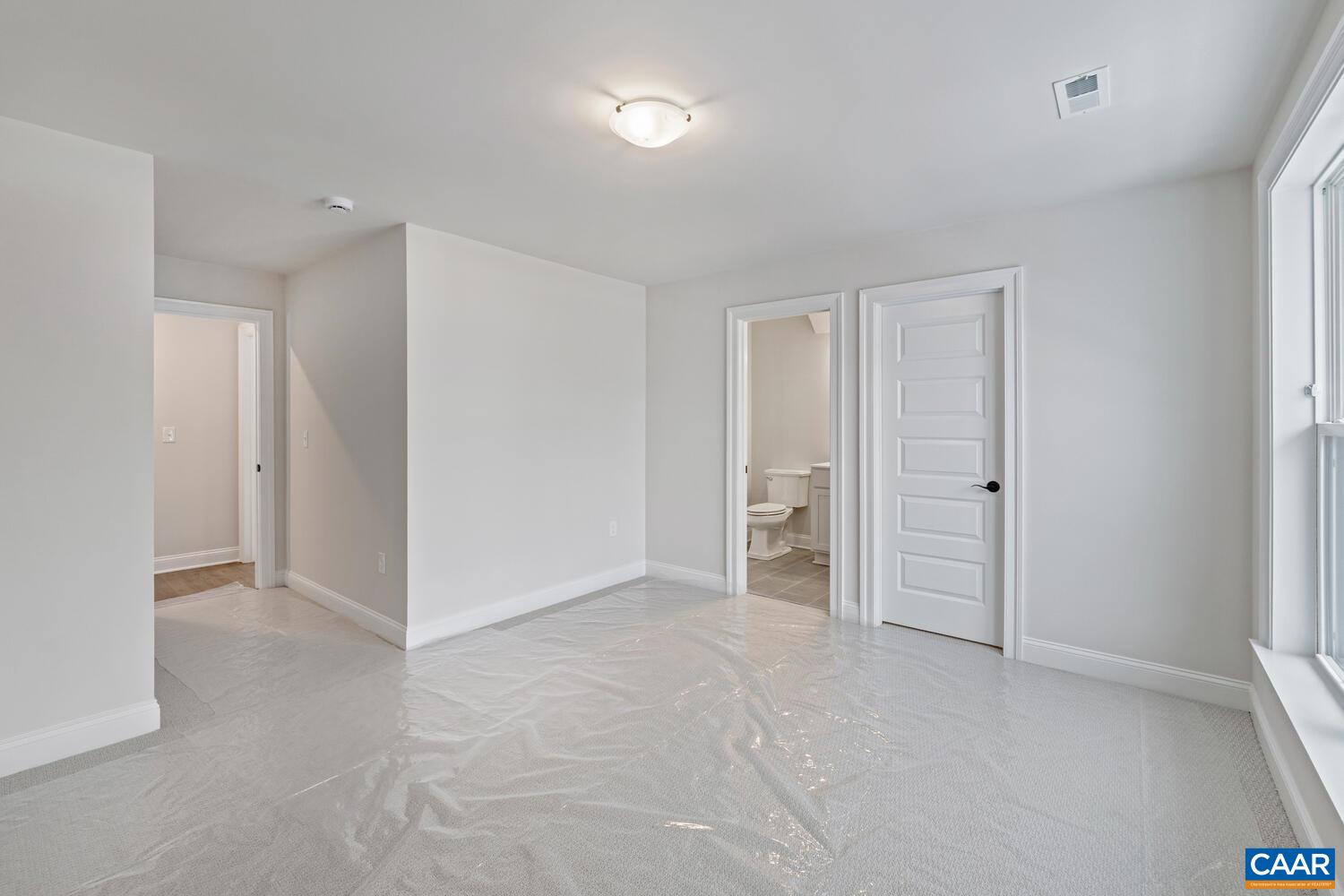 1731 Fowler Street Charlottesville, VA 22901 - Photo 36 of 54 an empty room with closet and mirrors