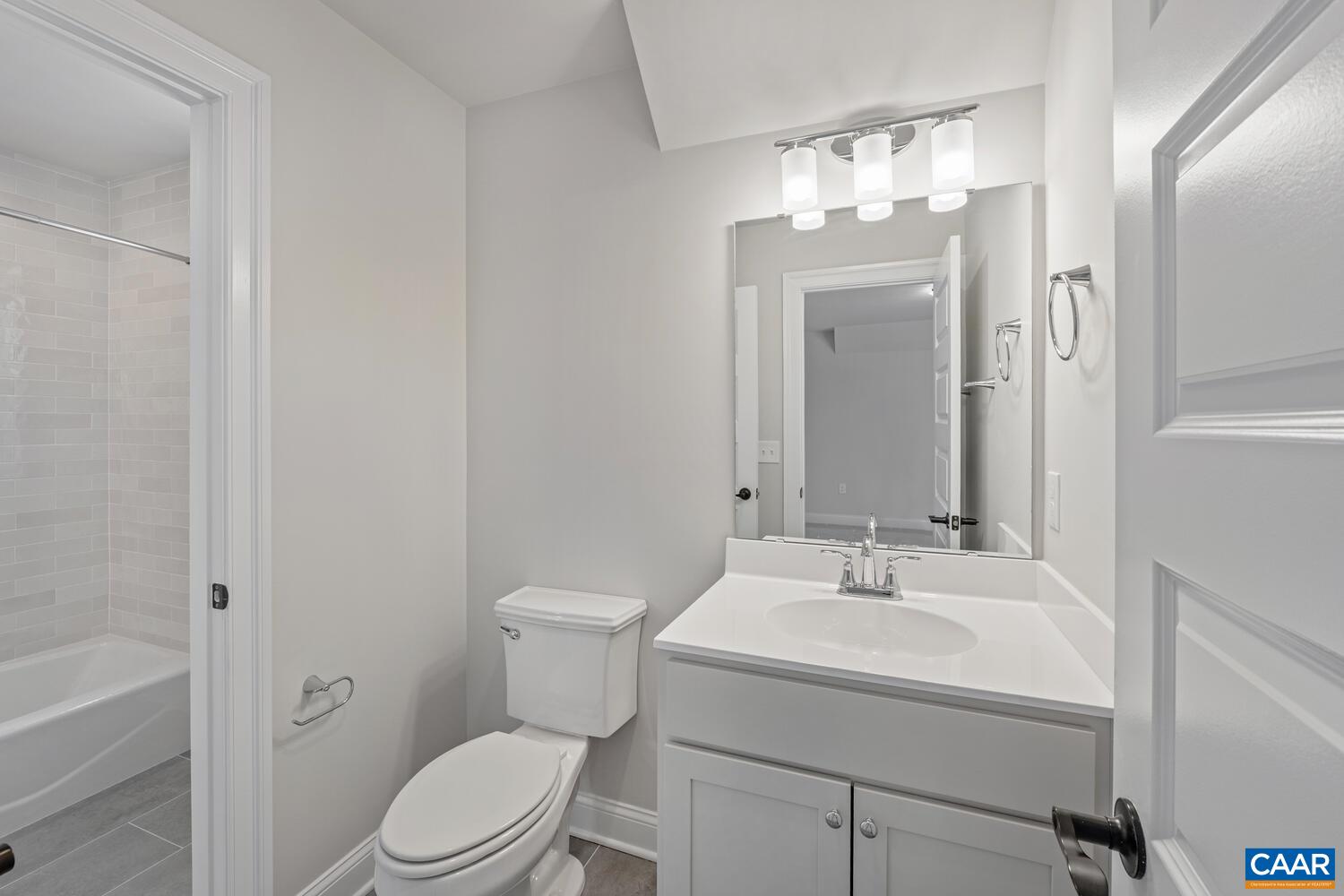 1731 Fowler Street Charlottesville, VA 22901 - Photo 40 of 54 a bathroom with a sink a toilet and shower