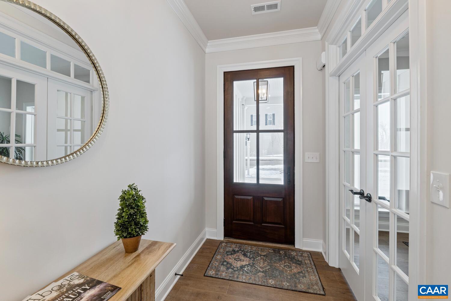 1731 Fowler Street Charlottesville, VA 22901 - Photo 6 of 54 a view of an entryway with wooden floor