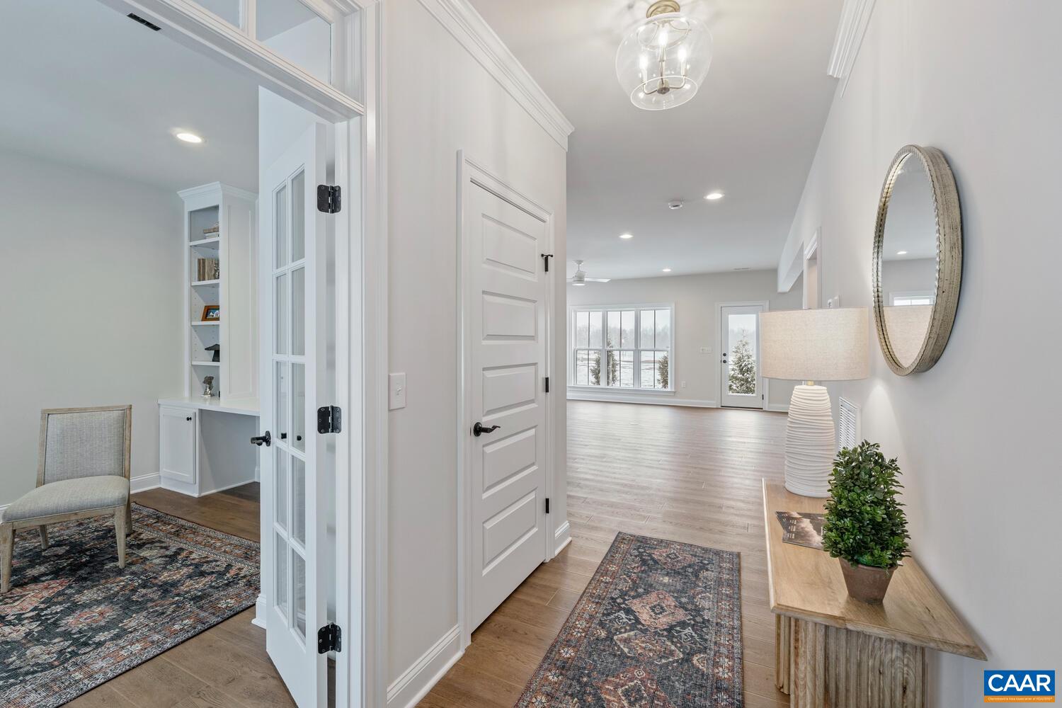 1731 Fowler Street Charlottesville, VA 22901 - Photo 7 of 54 a view of a hallway with wooden floor and a bathroom