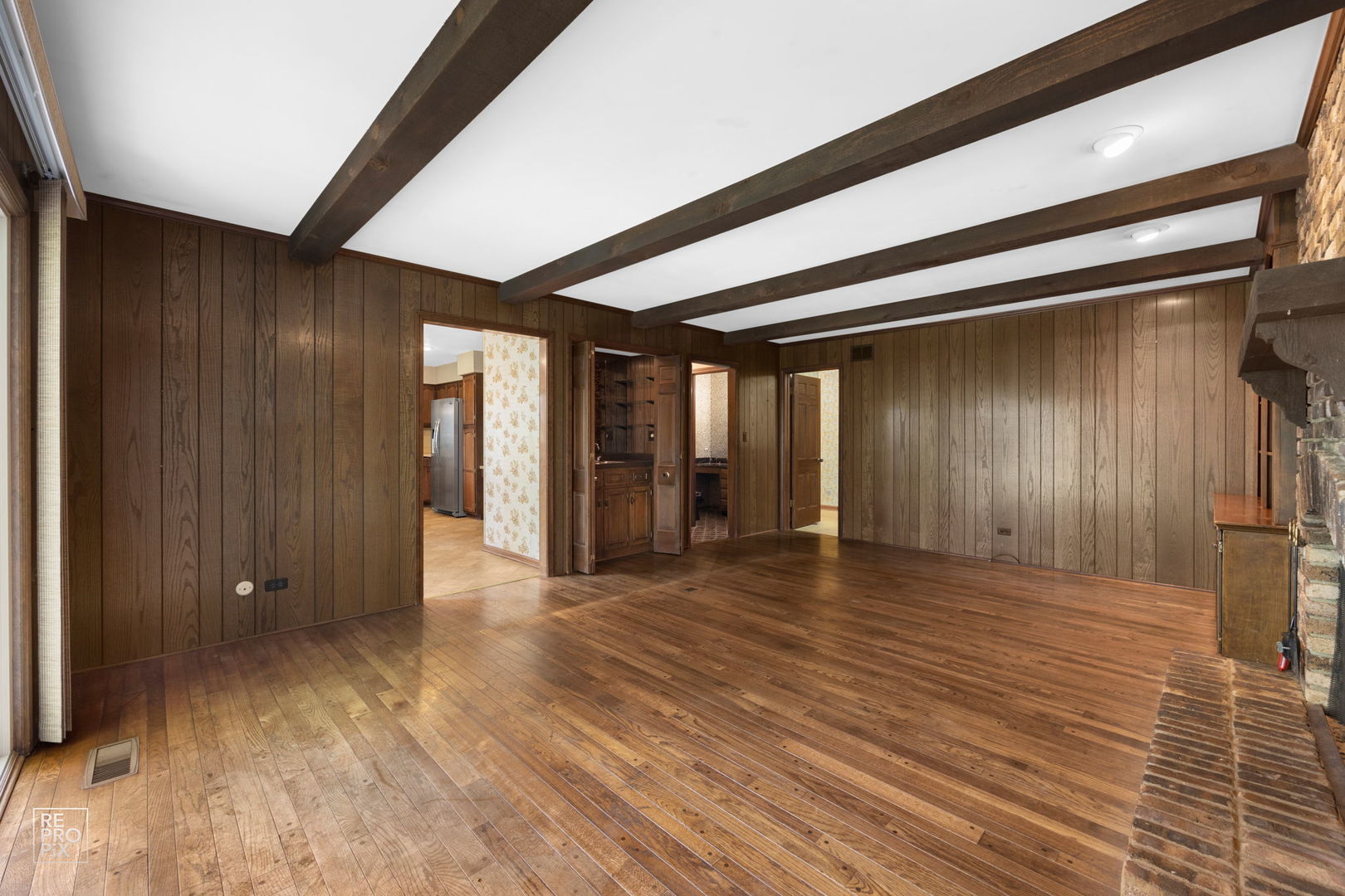615 Harding Road Hinsdale, IL 60521 - Photo 15 of 32 a view of an empty room with wooden floor and a window