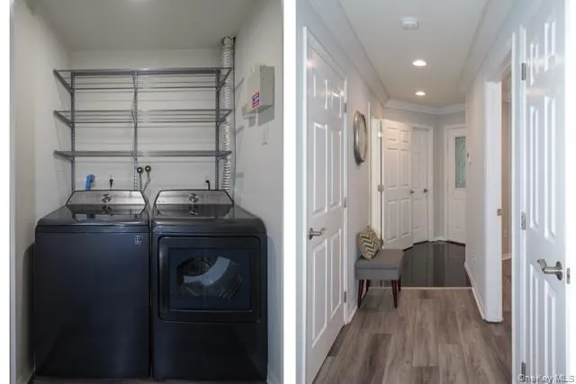 a view of hallway with furniture and wooden floor
