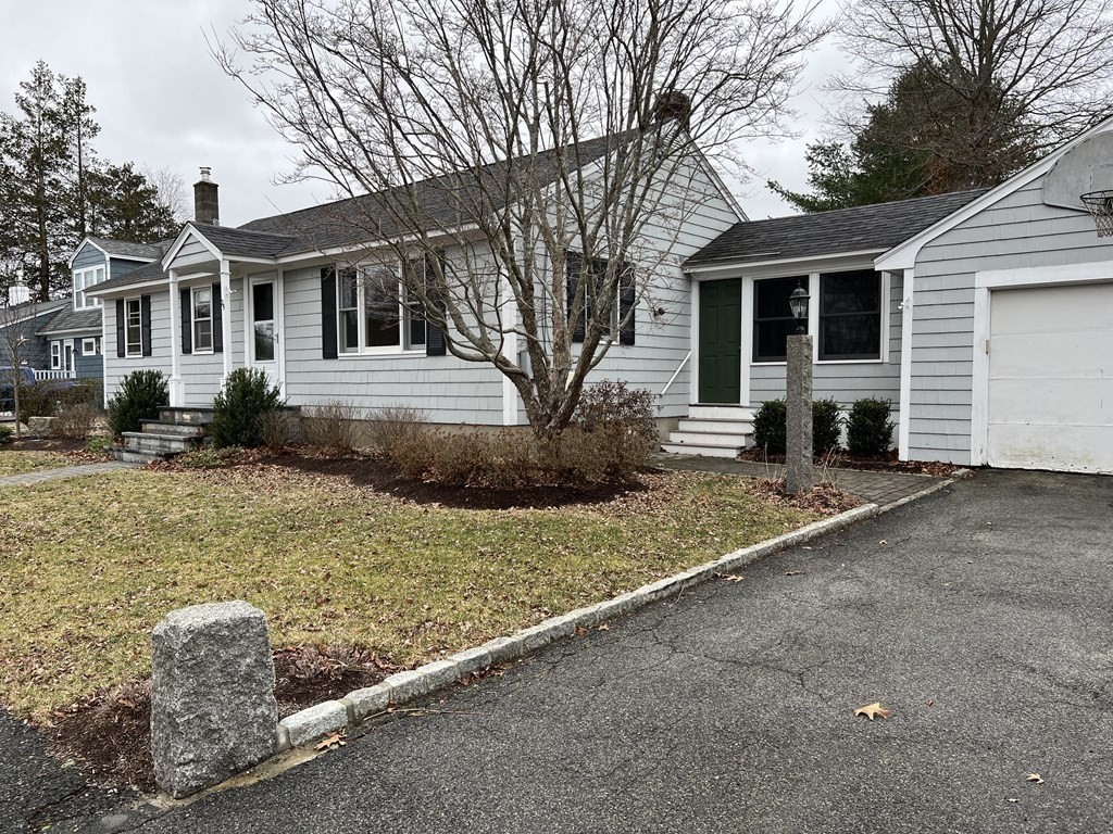 25 Margaret Road Hamilton, MA 01982 - Photo 1 of 33 a front view of a house with a yard
