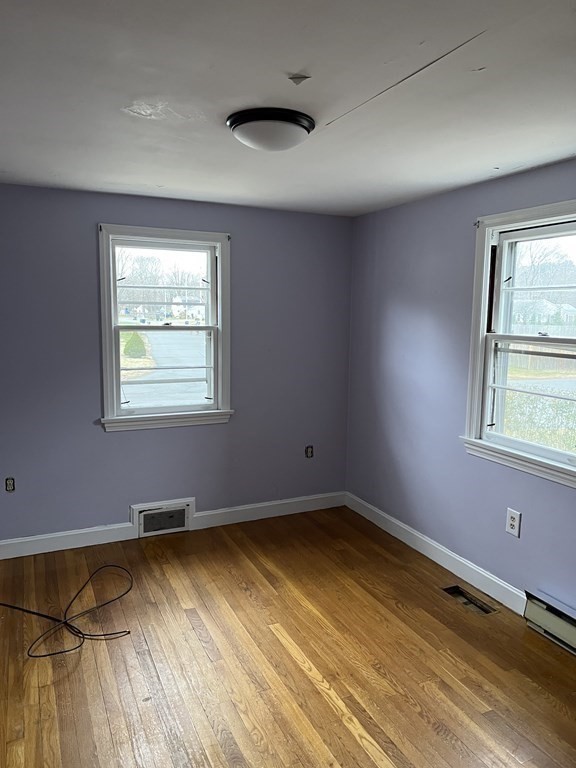 25 Margaret Road Hamilton, MA 01982 - Photo 14 of 33 a view of a room with wooden floor and windows