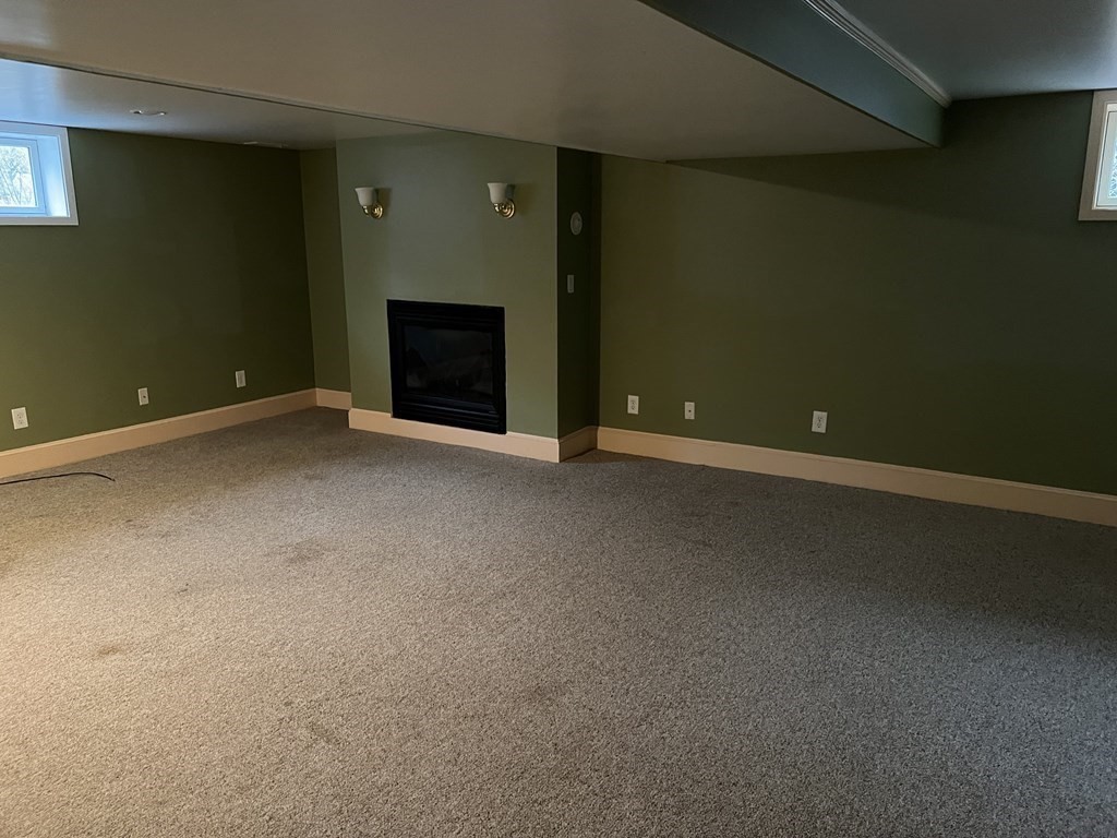25 Margaret Road Hamilton, MA 01982 - Photo 15 of 33 a view of an empty room with a fireplace