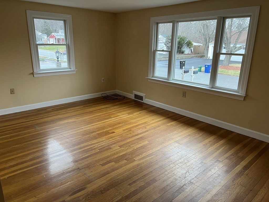 25 Margaret Road Hamilton, MA 01982 - Photo 10 of 33 a view of an empty room with wooden floor and a window