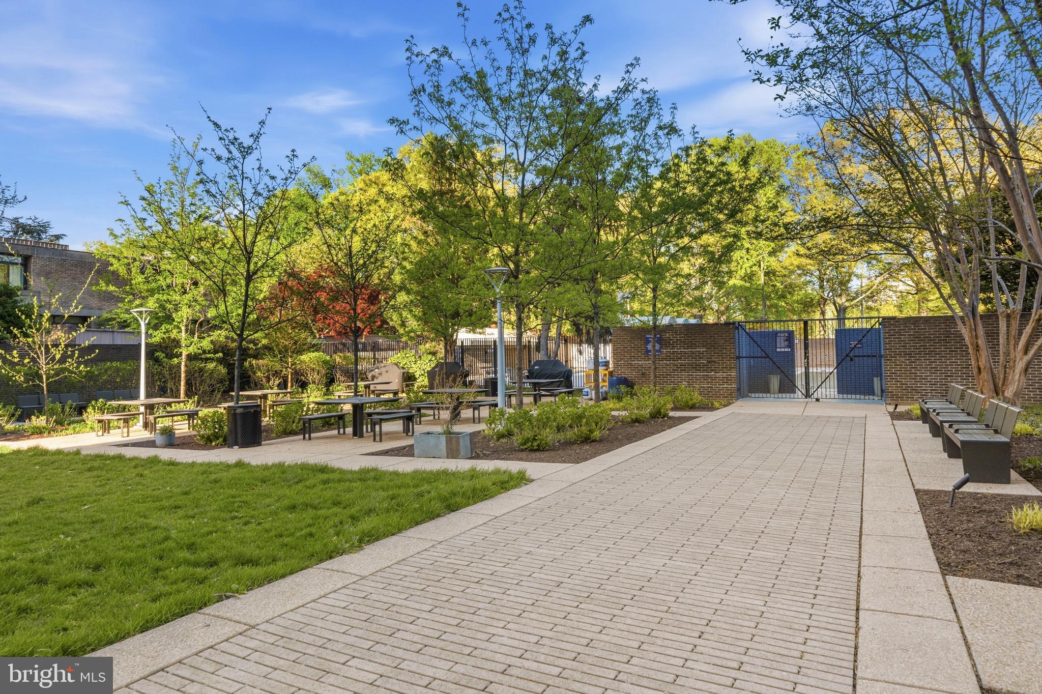 1311 Delaware Avenue Southwest, Unit S240 Washington, DC 20024 - Photo 17 of 25 a front view of a house with a yard