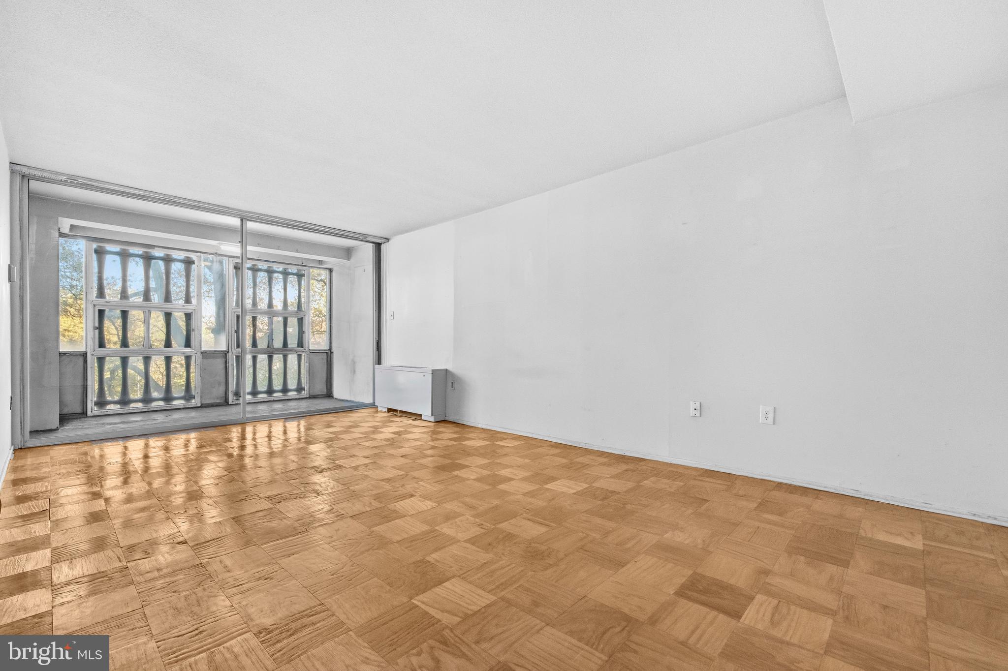 1311 Delaware Avenue Southwest, Unit S240 Washington, DC 20024 - Photo 3 of 25 a view of an empty room with a window