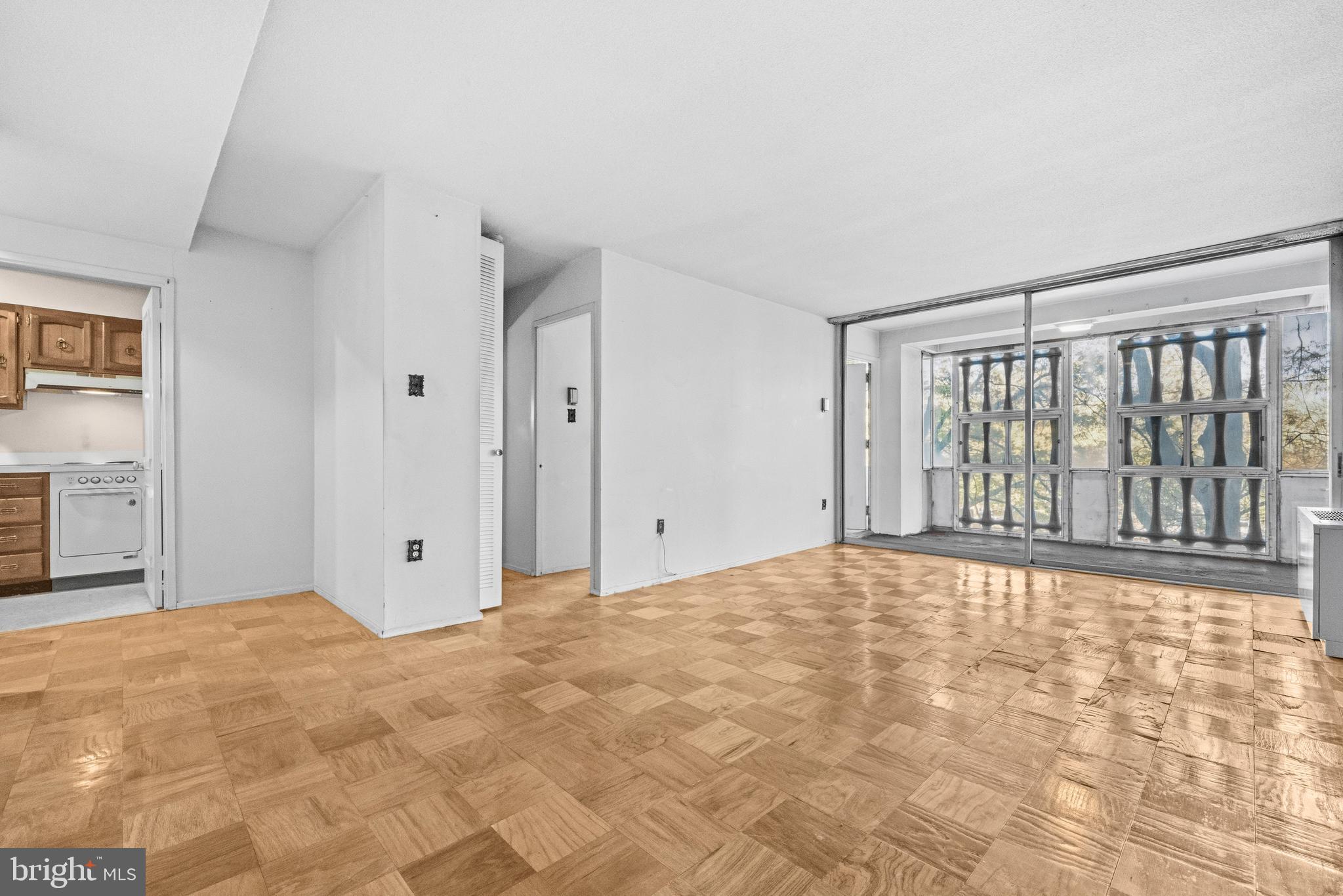 1311 Delaware Avenue Southwest, Unit S240 Washington, DC 20024 - Photo 6 of 25 a view of an empty room with a window