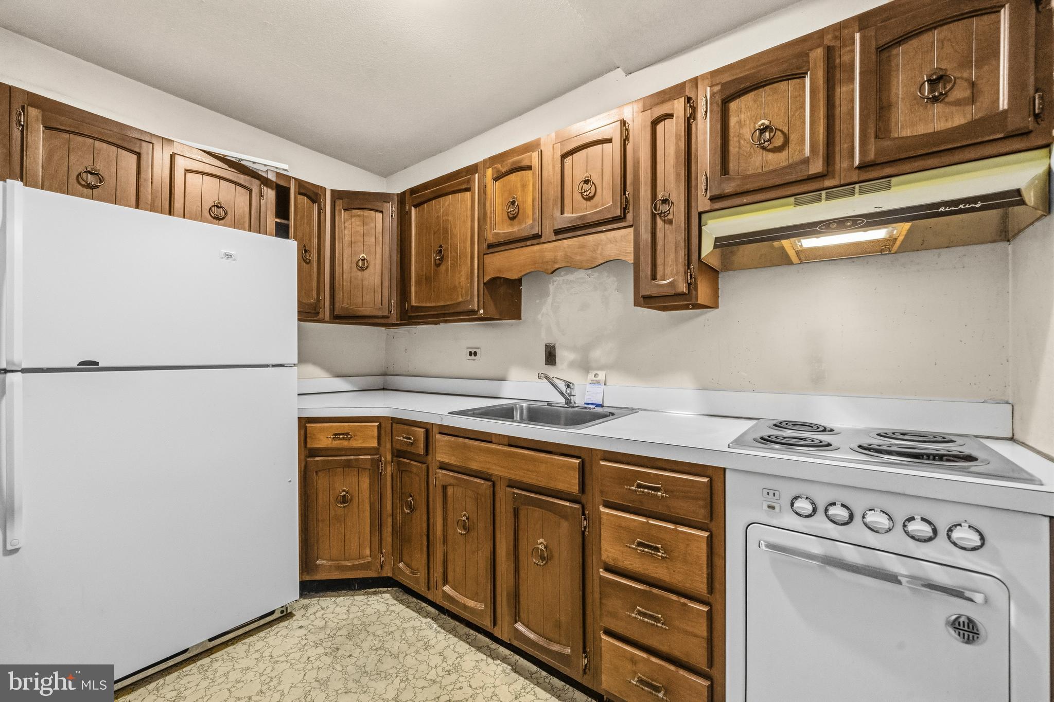 1311 Delaware Avenue Southwest, Unit S240 Washington, DC 20024 - Photo 7 of 25 a kitchen with stainless steel appliances granite countertop a refrigerator a stove a sink and dishwasher