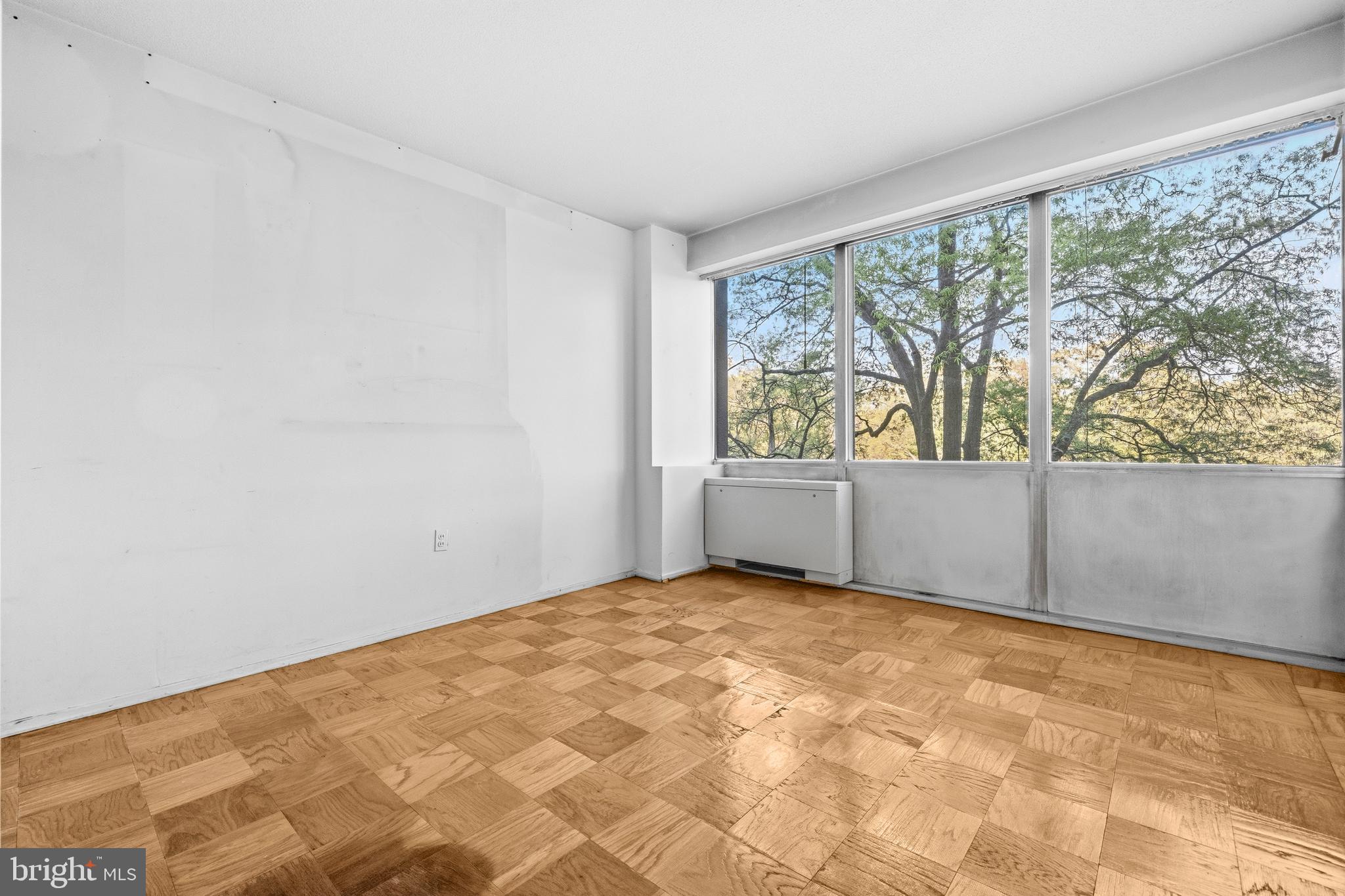 1311 Delaware Avenue Southwest, Unit S240 Washington, DC 20024 - Photo 9 of 25 a view of an empty room and window
