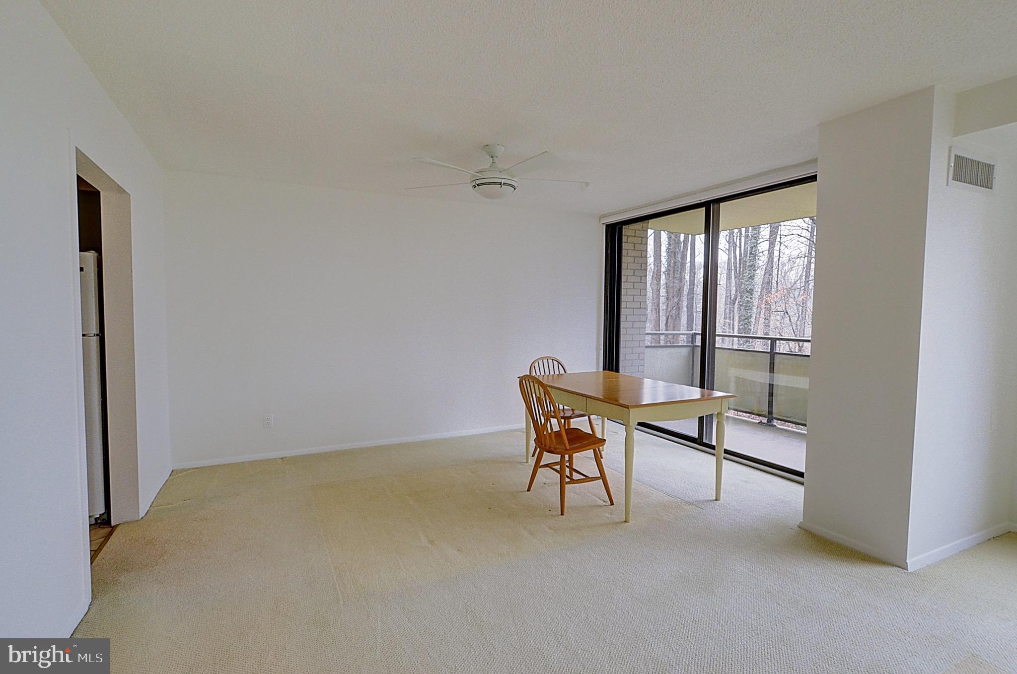 5225 Pooks Hill Road, Unit 308N Bethesda, MD 20814 - Photo 11 of 41 a balcony with table and chairs