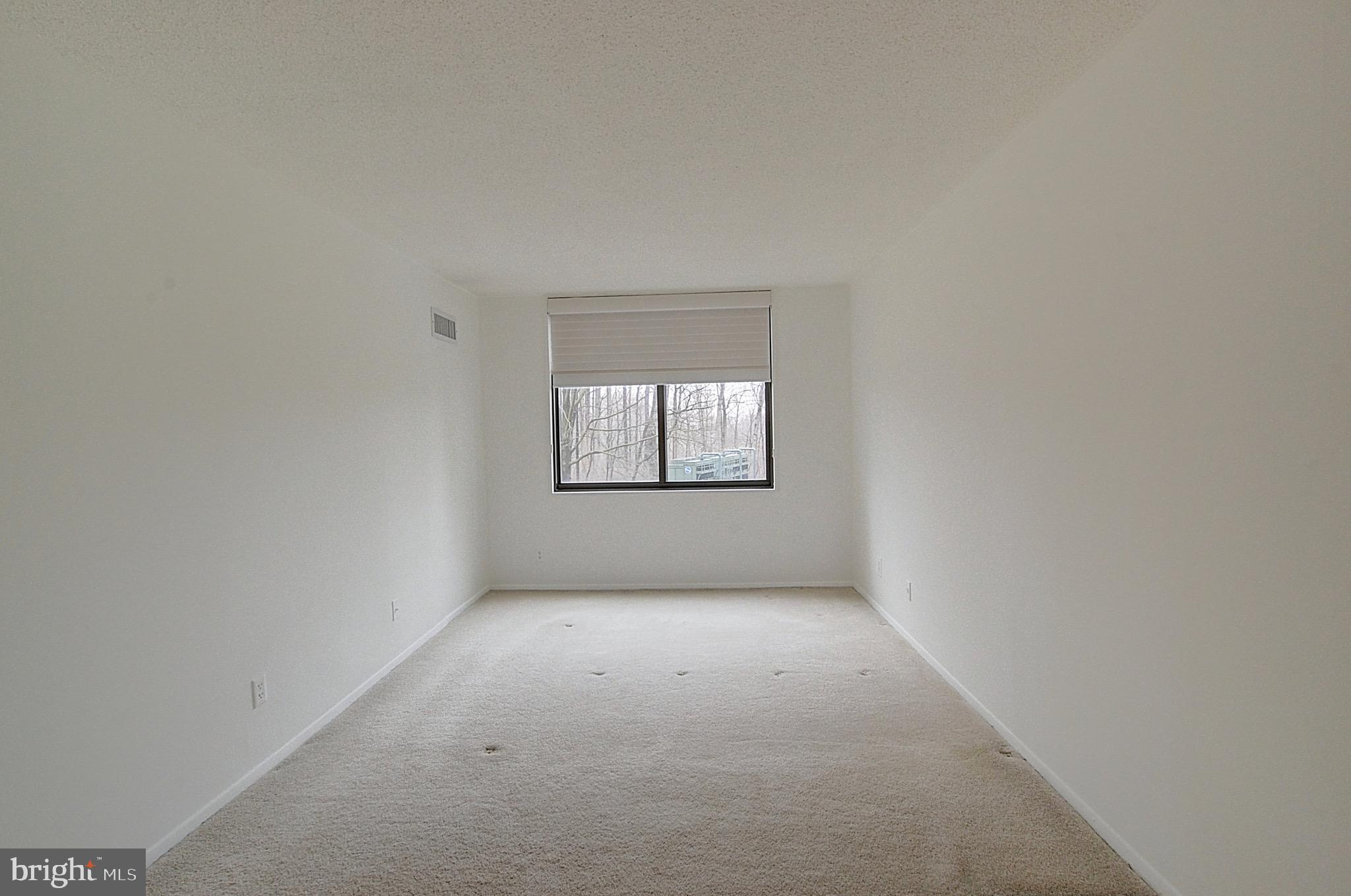 5225 Pooks Hill Road, Unit 308N Bethesda, MD 20814 - Photo 15 of 41 an empty room with windows