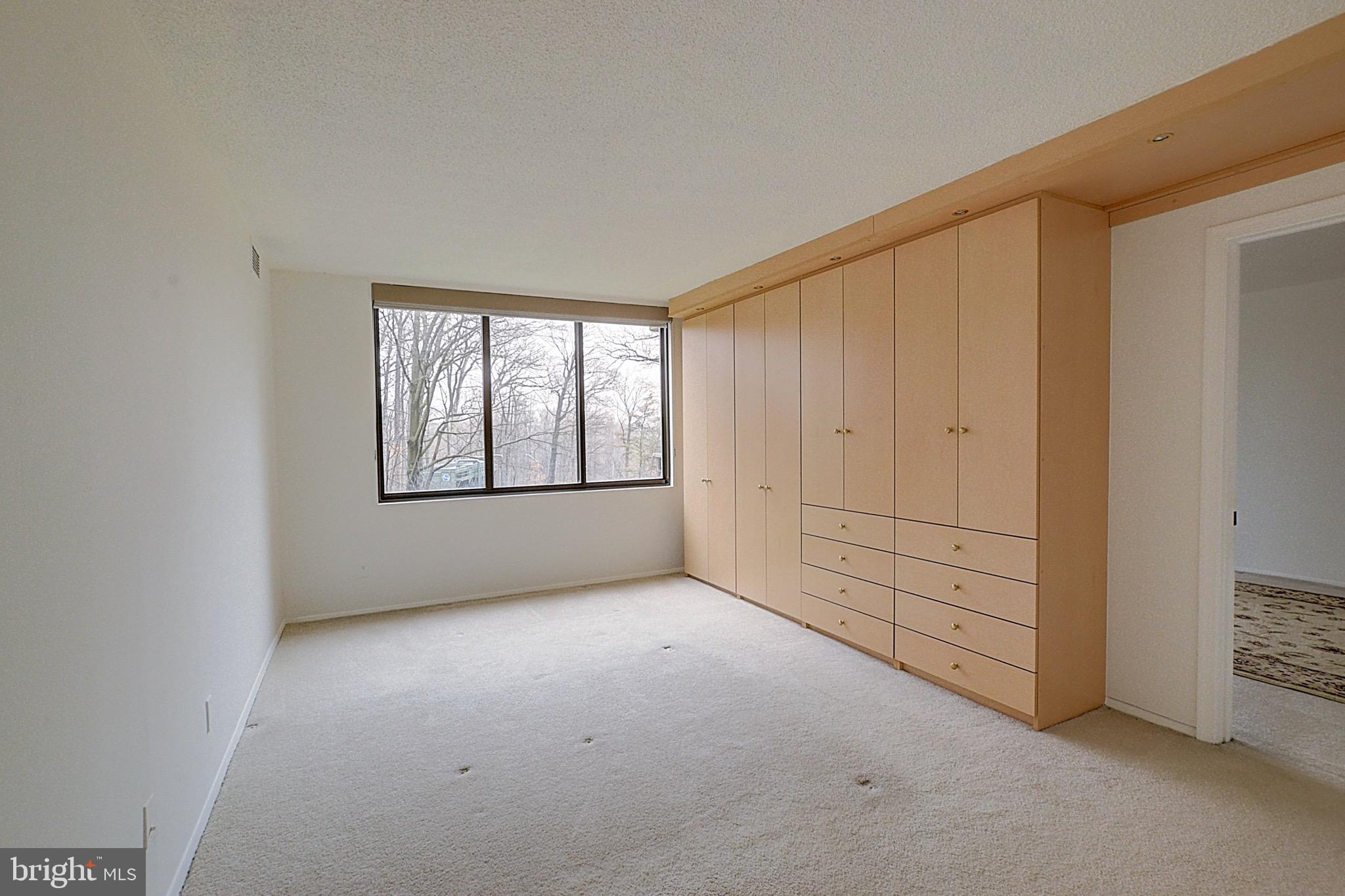 5225 Pooks Hill Road, Unit 308N Bethesda, MD 20814 - Photo 16 of 41 an empty room with windows