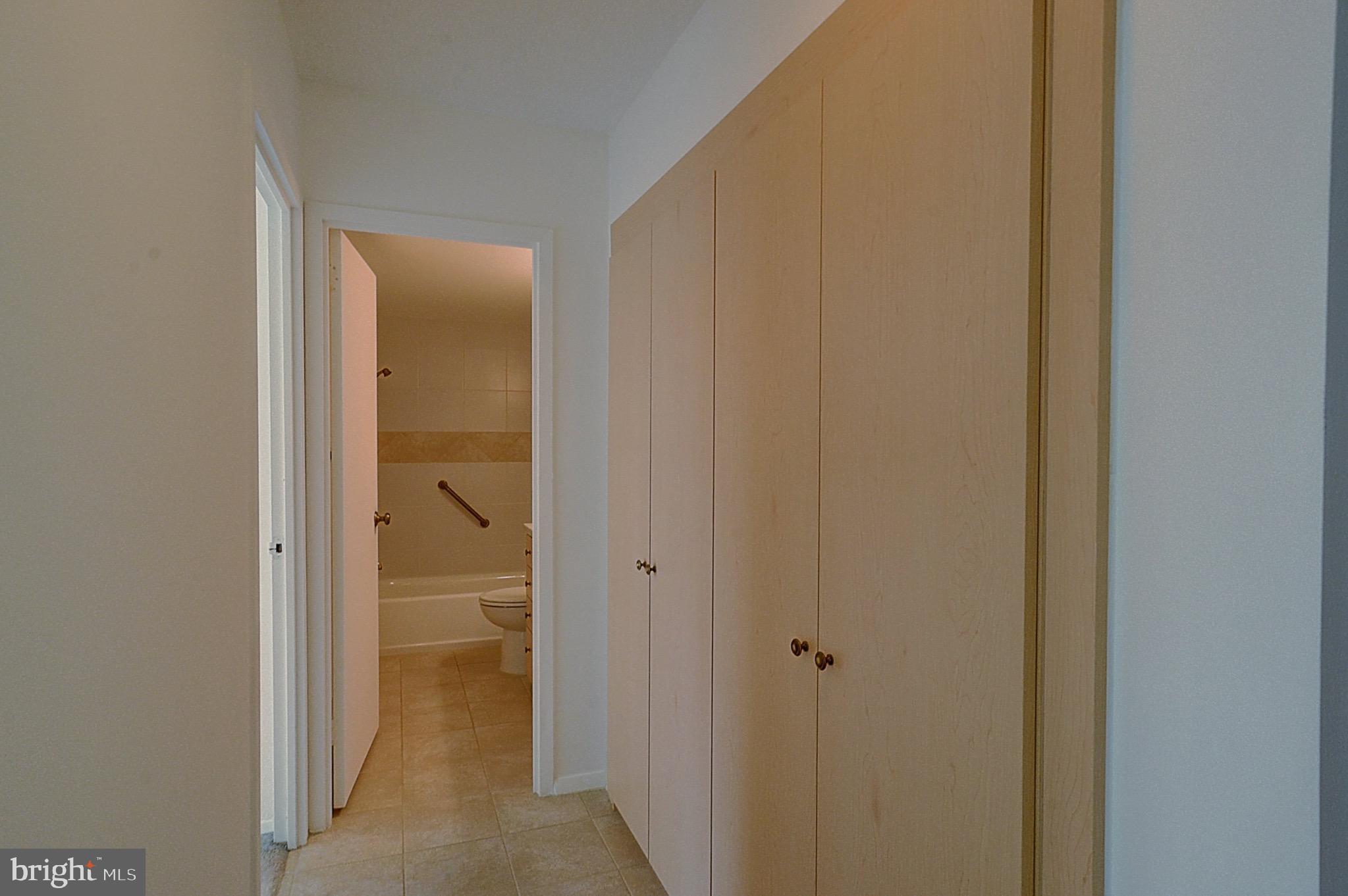 5225 Pooks Hill Road, Unit 308N Bethesda, MD 20814 - Photo 8 of 41 a view of a bathroom from a hallway