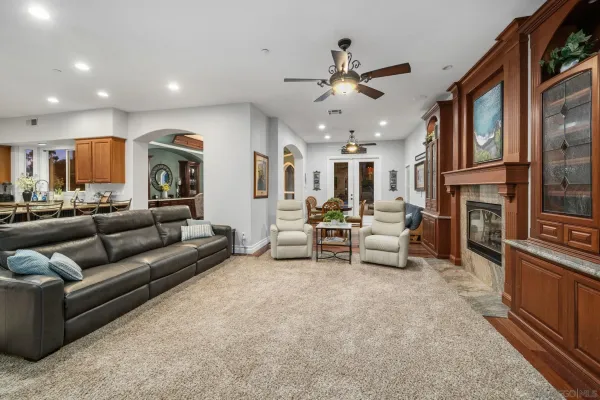 a bathroom with a tub a sink and a large mirror