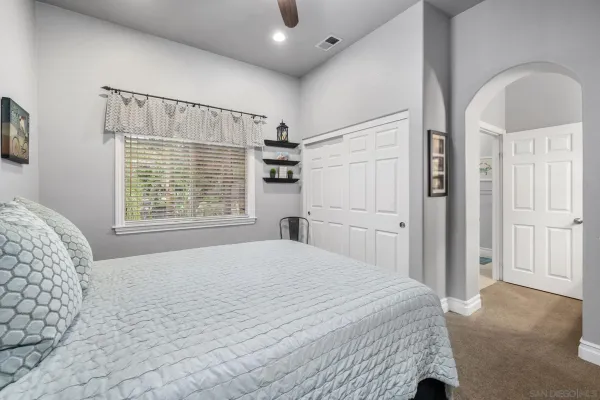 a kitchen with stainless steel appliances kitchen island granite countertop a sink stove microwave and refrigerator