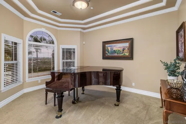 a bedroom with a large bed and a book shelf