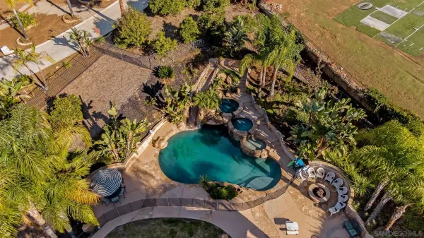a front view of a house with a yard and a garage