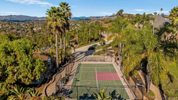 a view of an outdoor sitting area with brick wall