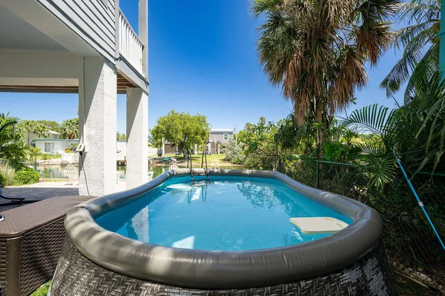 a view of outdoor space and swimming pool