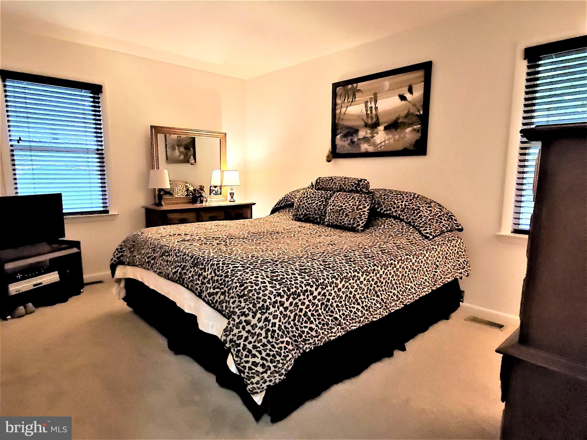 1212 Keithmont Road Catonsville, MD 21228 - Photo 13 of 33 a bedroom with a bed and wooden floor