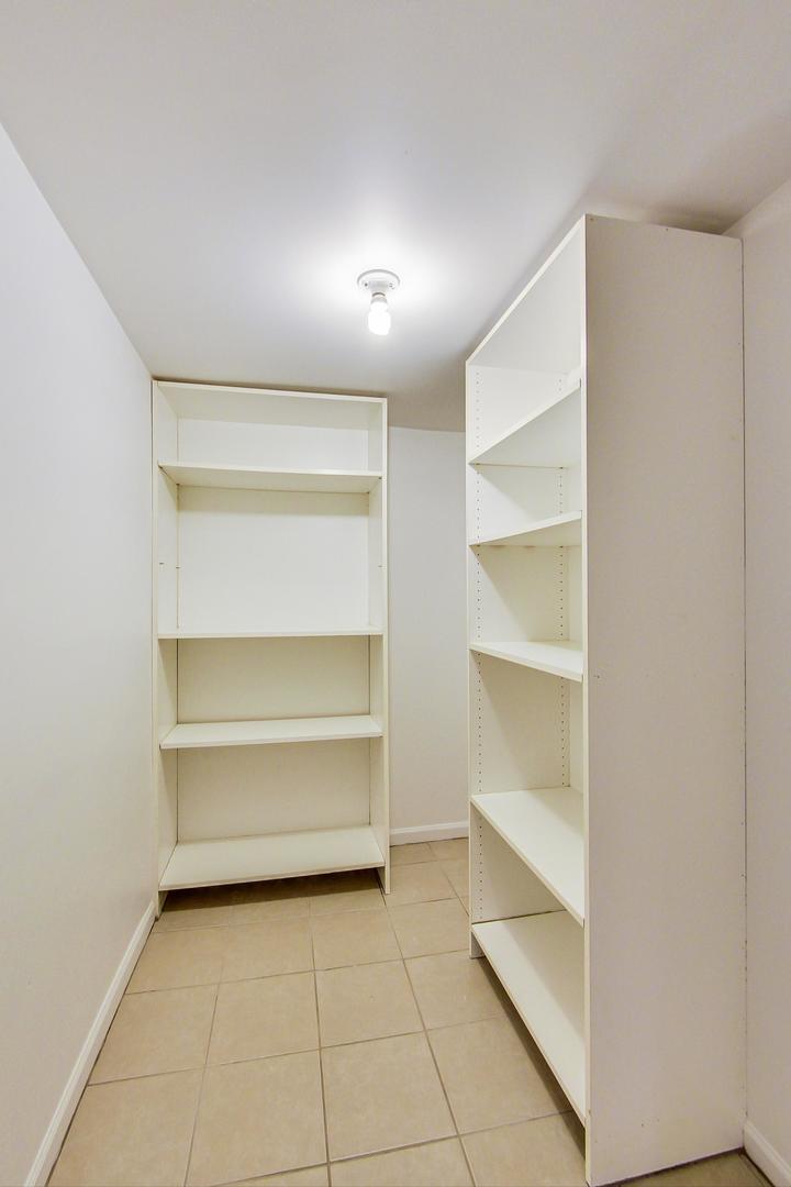 825 Oakton Street Park Ridge, IL 60068 - Photo 21 of 24 a view of an empty walk in closet