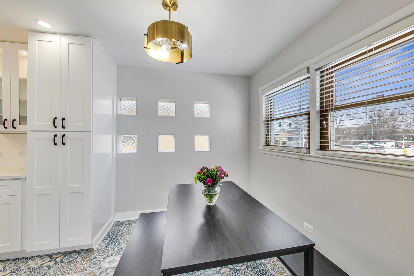 825 Oakton Street Park Ridge, IL 60068 - Photo 5 of 24 a view of a dining room with a table and chairs