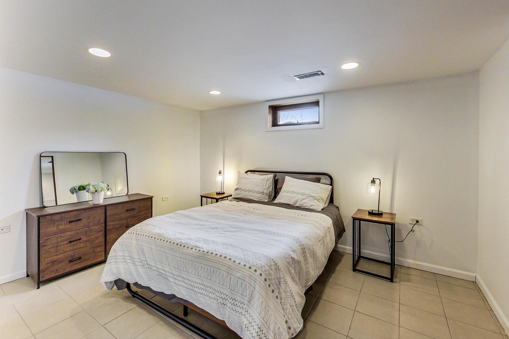 825 Oakton Street Park Ridge, IL 60068 - Photo 10 of 24 a bedroom with a bed and a dresser