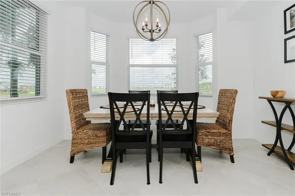a view of a dining room with furniture and a window