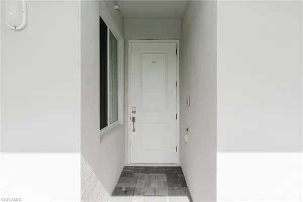 a view of walk in closet with white walls