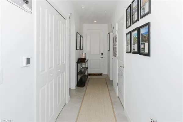 a view of a hallway with a white walls
