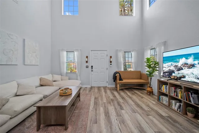 a living room with furniture and a book shelf