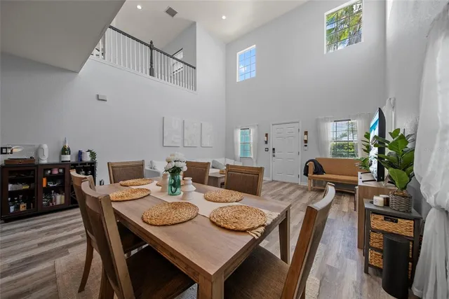 a view of a dining room with furniture and wooden floor